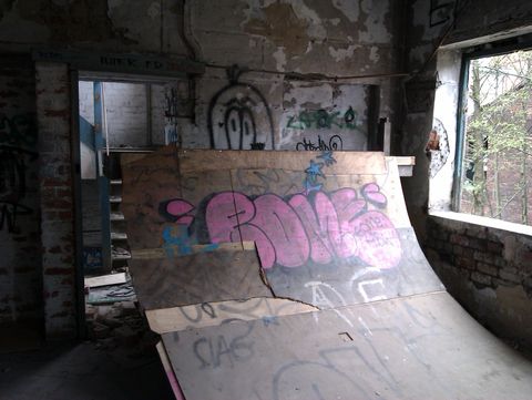 A plywood quarterpipe skate ramp painted with a 