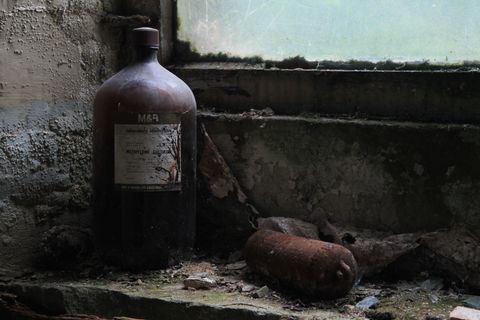 A large, brown glass bottle labelled 